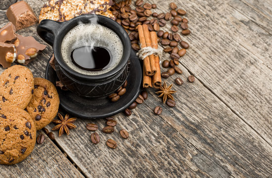 coffee and cookies on wood background