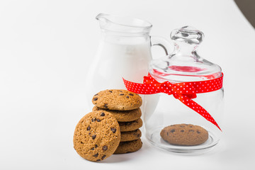 Cookies in a jar decorated with a red ribbon