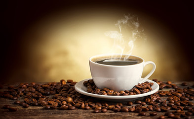 Coffee cup and saucer on a wooden table. Dark background
