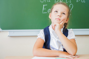 Desktop background of student sitting at desk for classwork