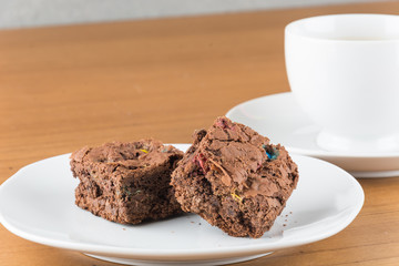 brownies in plate on wood table