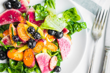 Summer salad with vegetables and berries