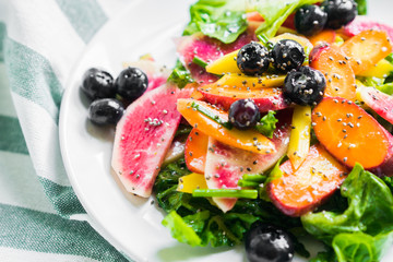 Summer salad with vegetables and berries