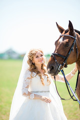 Obraz premium portrait of a beautiful bride and horse