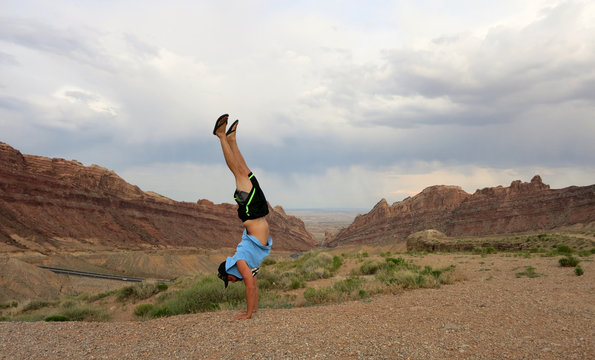 Man Handstands Spotted Wolf Canyon edge