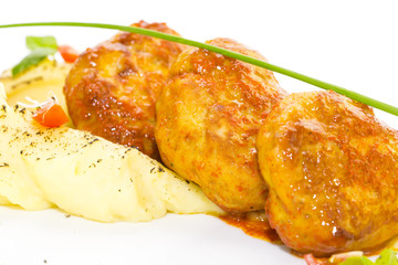 cutlets fried in carrot sauce with mashed potatoes
