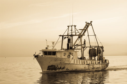 Fishing boat off coast of Florida.  Vintage artistic filters applied. 