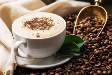 Hot coffee and pastries on a wooden background