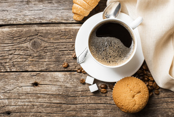 cup of coffee and coffee beans, view from the top