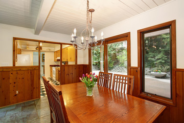 Unique dinning room with wood pantel interior.