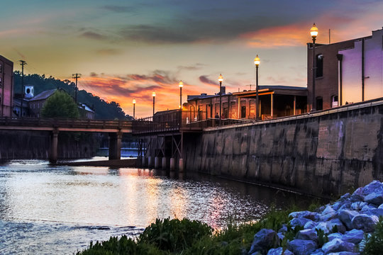 Locals enjoying an evening stroll along Autauga Creek in Prattville, Alabama
