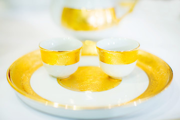 Cup of tea with teapot