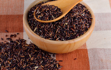 Rice berry in wooden bowl