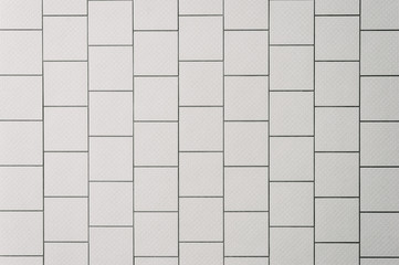 background of a tiled wall, white tiles with black grout