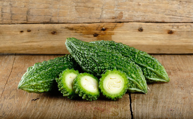 Green bitter gourd on the wooden background