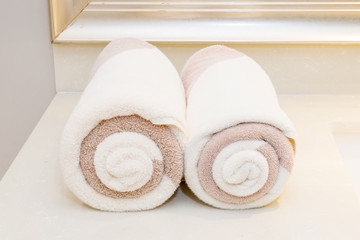 Rolled up white spa towels