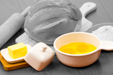 Bread and rolling pin black white sourrounded by colorful cheese