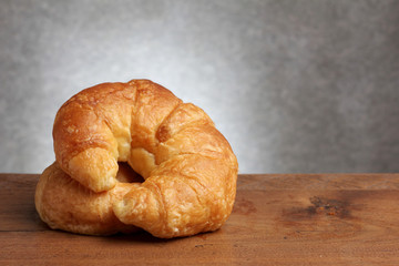 croissant bakery on teakwood table