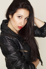 Portrait of beautiful young woman in leather jacket