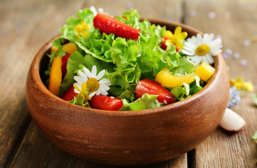 Light organic salad with flowers, close up