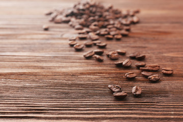 Coffee beans on wooden background