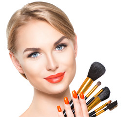 Beauty Woman with makeup Brushes