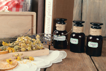 Different dried herbs and lemon on table close up