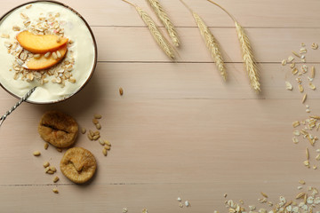 Fototapeta na wymiar Healthy homemade oatmeal on wooden table, close up