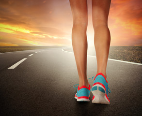 Runner feet running on road