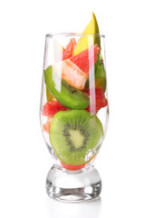 Fresh fruits salad in glass isolated on white