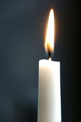 white candle with grey background