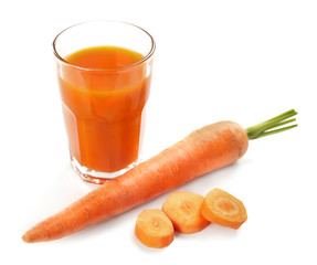 Glass of carrot juice with vegetable slices with vegetables isolated on white