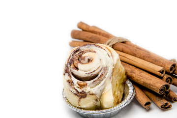 Mini cinnamon roll with cinnamon stick roped isolated