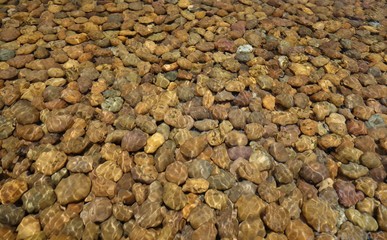 Pebble stone under water