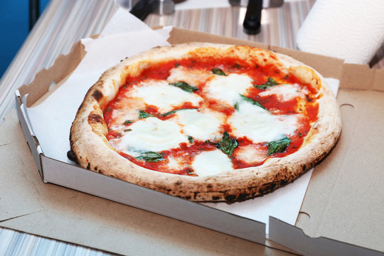 Delicious pizza with mozzarella in box, closeup