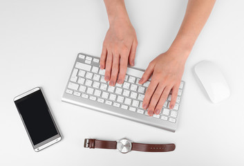Fototapeta na wymiar Female hand with computer keyboard isolated on white