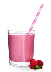 Glass of raspberry milk shake on light background