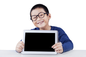 Child showing blank tablet screen