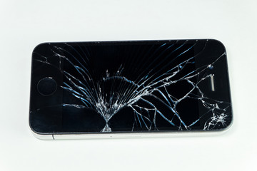 Broken screen mobile smartphone isolated on white background.