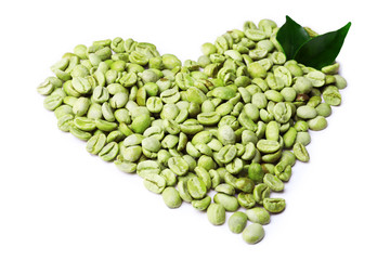 Green coffee beans with leaves isolated on white