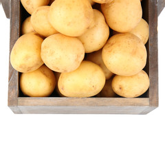 New potatoes in wooden table isolated on white