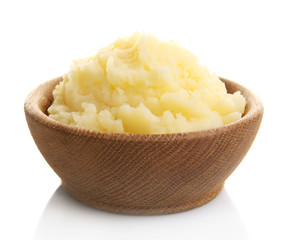 Mashed potatoes in wooden bowl isolated on white