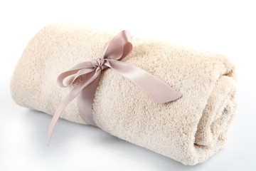 Rolled up colorful towel isolated on white