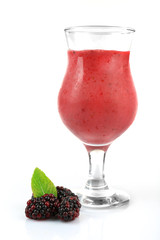 Glass of blackberry smoothie isolated on white
