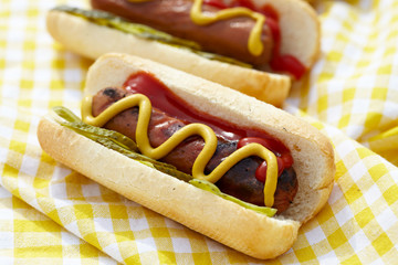 Grilled hot dogs with mustard, ketchup and relish