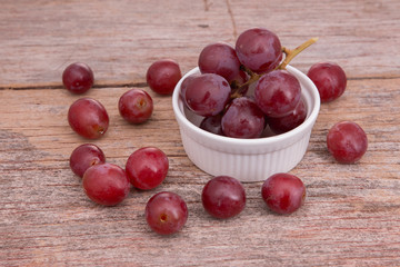 Grapes in a white cup