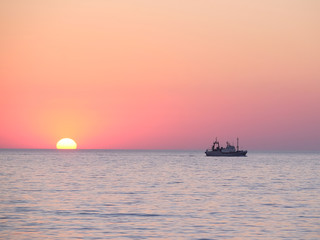 Landscape with the image of a sea sunset