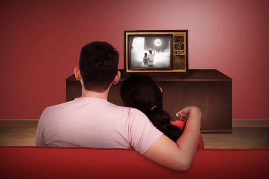 Young Asian Couple Watching Retro Tv