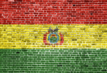 Flag of Bolivia painted on brick wall, background texture