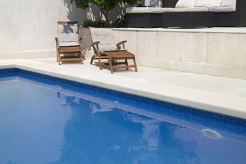 Beach chair near the swimming pool